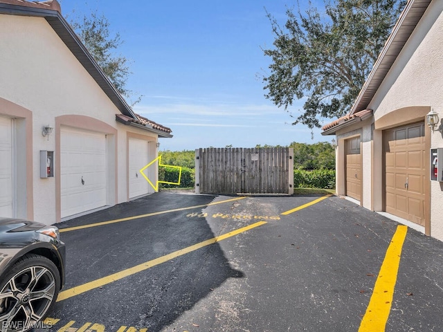 view of car parking with a garage