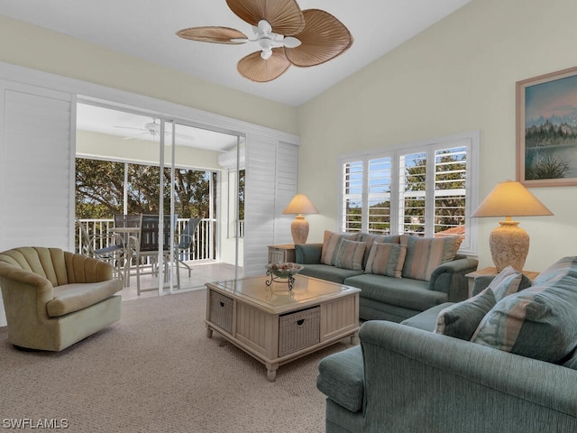 carpeted living room featuring lofted ceiling and ceiling fan