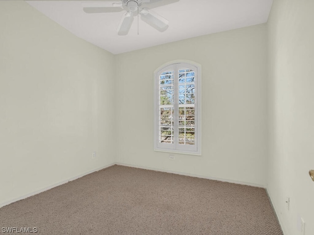 empty room featuring ceiling fan and carpet floors