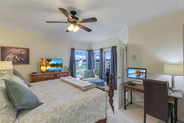 carpeted bedroom featuring crown molding and ceiling fan