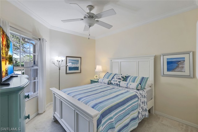 carpeted bedroom with ceiling fan and crown molding