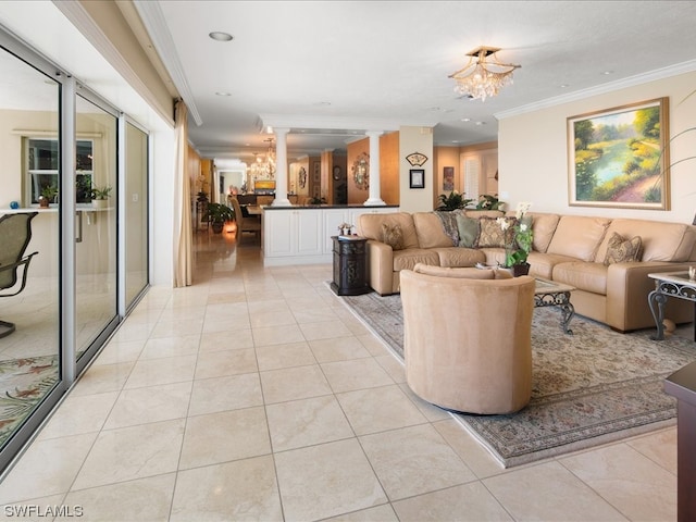 tiled living room with a notable chandelier, crown molding, and ornate columns