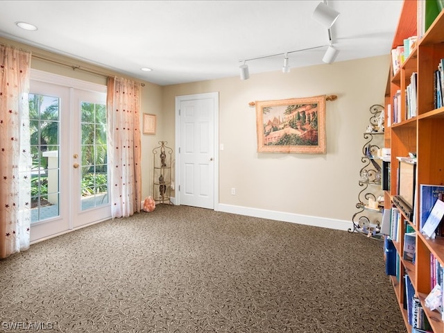 miscellaneous room with french doors and track lighting