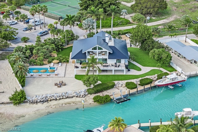 birds eye view of property with a water view