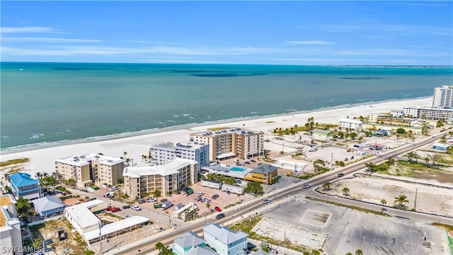 birds eye view of property with a view of the beach and a water view