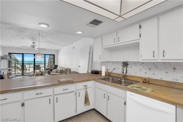 kitchen with sink, white cabinetry, ceiling fan, and white dishwasher