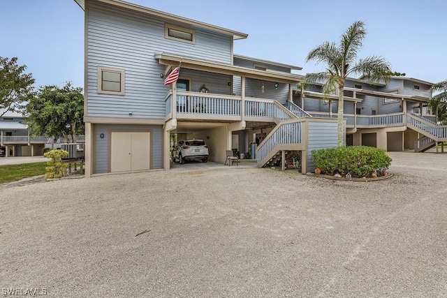 view of front of home featuring a deck and a garage