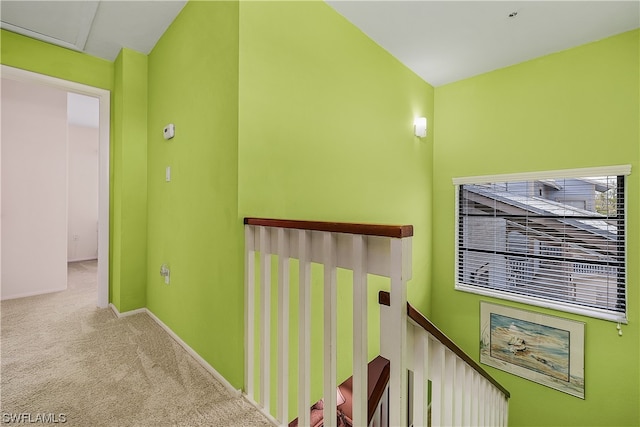 hallway with light colored carpet