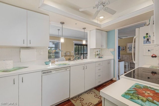 kitchen with white appliances, ceiling fan, hanging light fixtures, dark hardwood / wood-style flooring, and backsplash