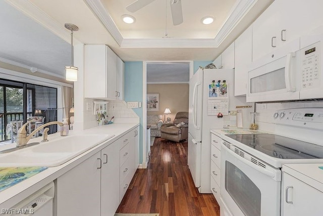 kitchen with hanging light fixtures, white cabinetry, dark hardwood / wood-style floors, ceiling fan, and white appliances