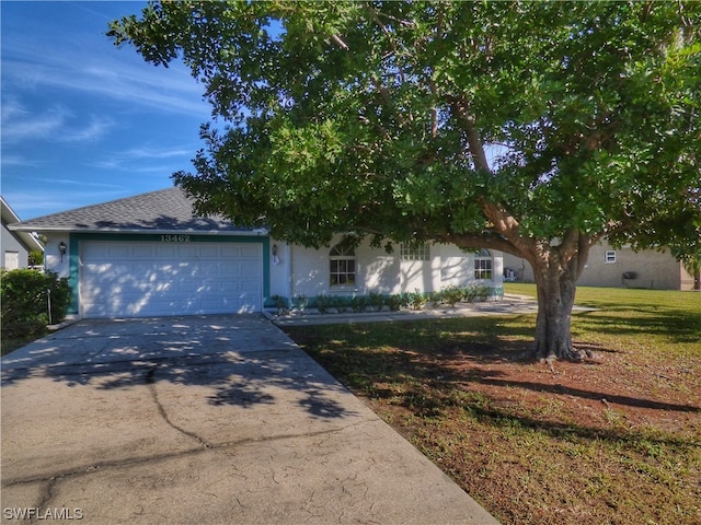 view of front facade with a front lawn and a garage