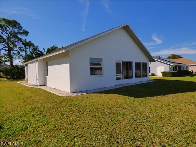 view of side of property featuring a lawn