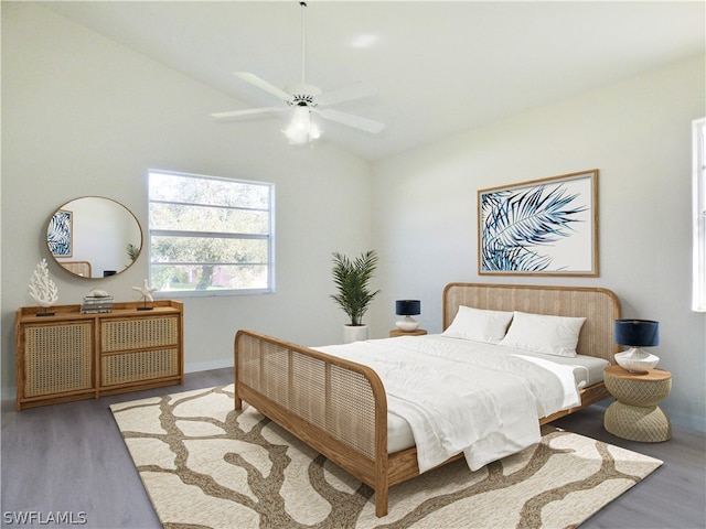 bedroom featuring vaulted ceiling, ceiling fan, and wood-type flooring