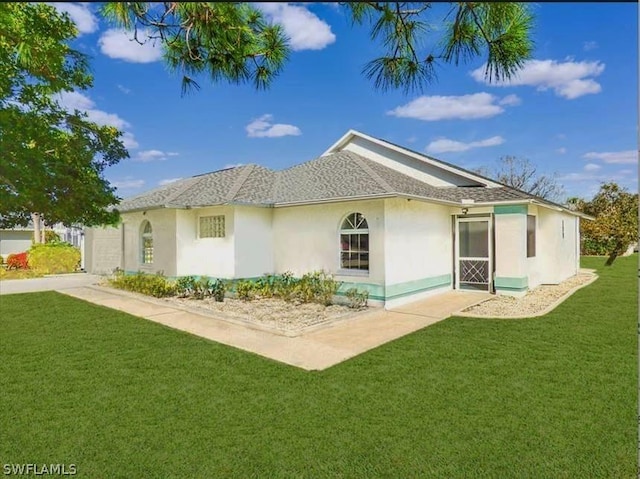 rear view of house with a lawn