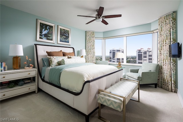 bedroom with light colored carpet and ceiling fan