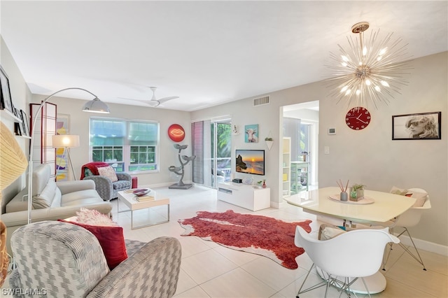 tiled living room featuring ceiling fan with notable chandelier