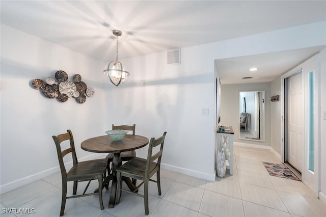 dining space with visible vents, baseboards, and light tile patterned floors