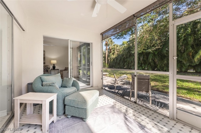 sunroom with a ceiling fan