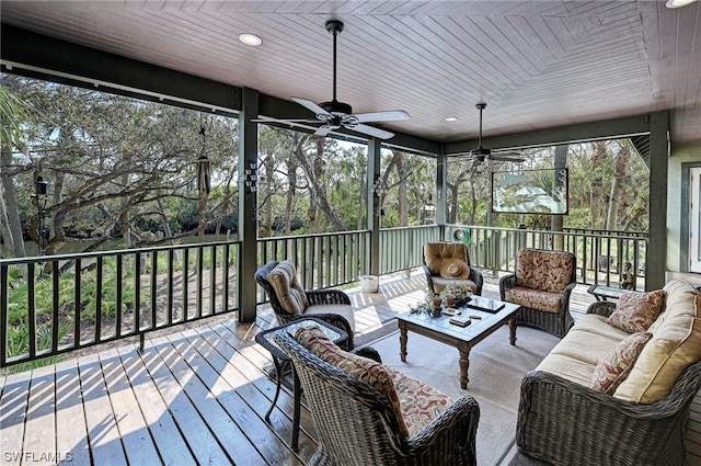 sunroom / solarium with wood ceiling and ceiling fan