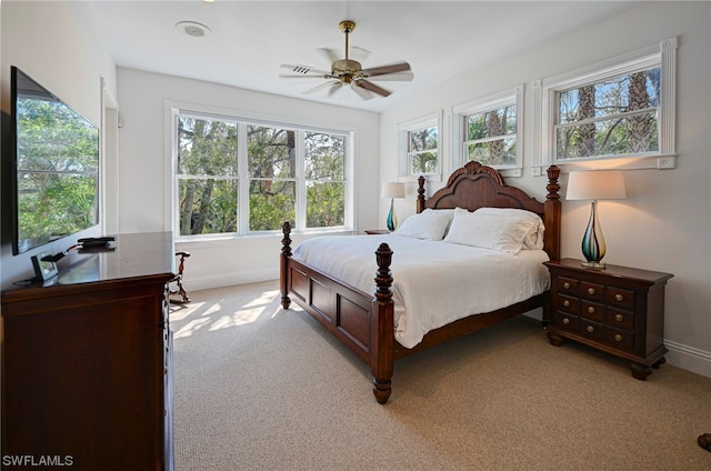 bedroom with light carpet and ceiling fan