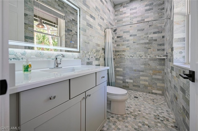 bathroom with vanity, tile flooring, a shower with shower curtain, and toilet