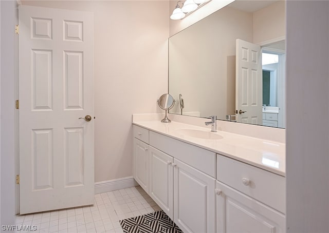 bathroom featuring vanity and tile flooring