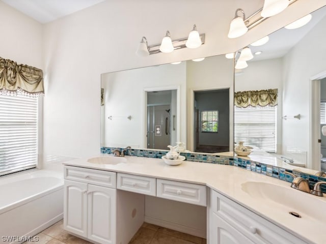 full bathroom featuring toilet, tile patterned flooring, separate shower and tub, and vanity