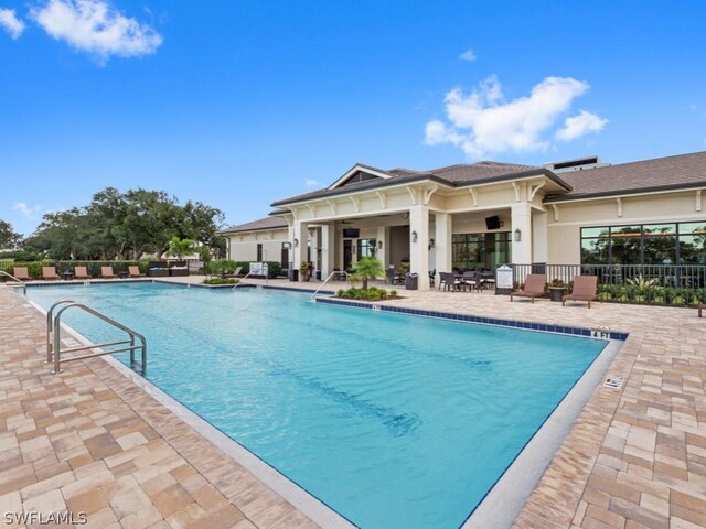 view of swimming pool with a patio area