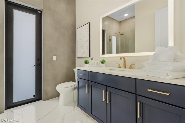 bathroom featuring vanity, toilet, and walk in shower