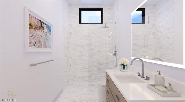 bathroom with vanity, a shower, and toilet