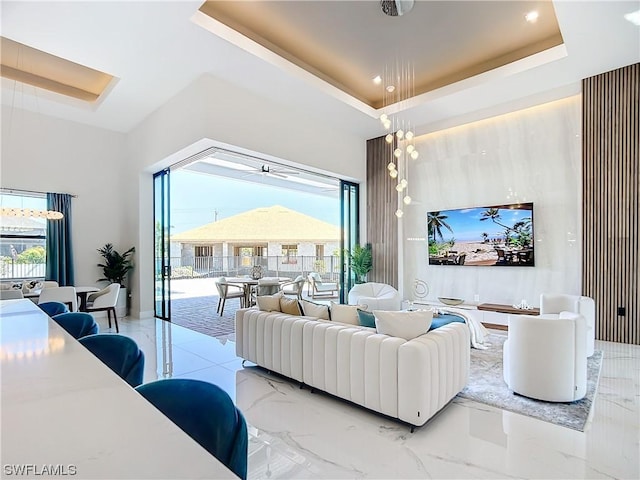 living room featuring a raised ceiling