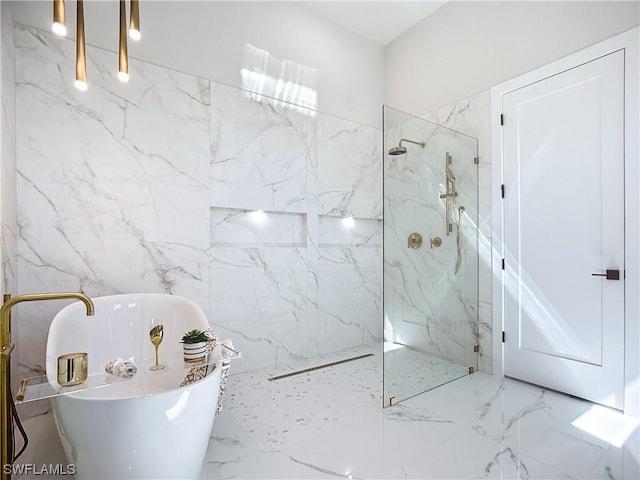 bathroom featuring shower with separate bathtub