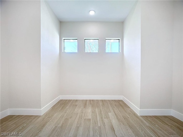 unfurnished room with light wood-type flooring