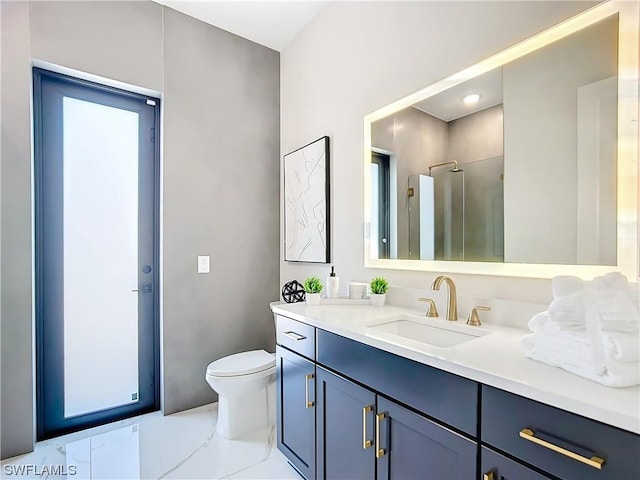 bathroom featuring vanity, walk in shower, and toilet