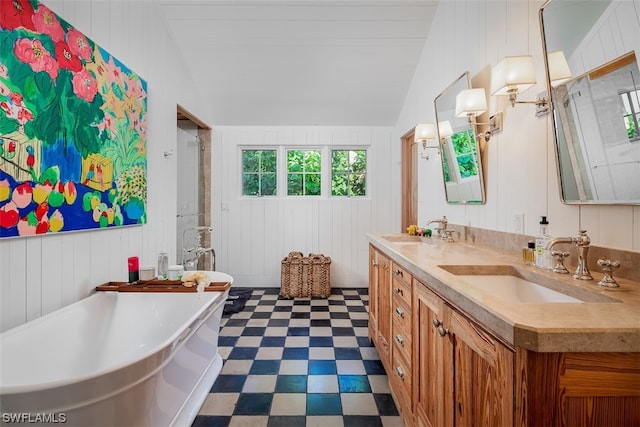 bathroom with tile flooring, lofted ceiling, wood walls, dual vanity, and a bathing tub