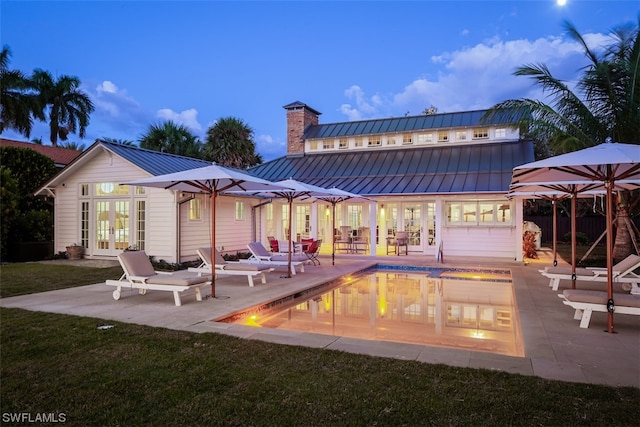 exterior space featuring an outdoor hangout area, a lawn, and a patio area