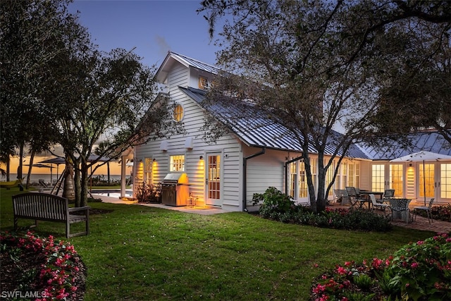 view of front of home with a lawn