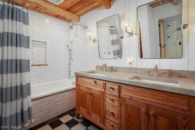 bathroom with shower / bath combo, oversized vanity, double sink, and tile flooring