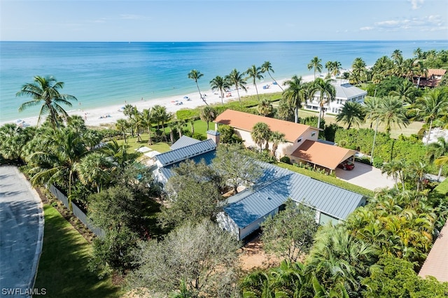 aerial view with a water view and a view of the beach