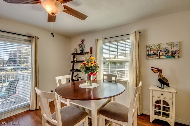 dining space featuring dark hardwood / wood-style floors and ceiling fan