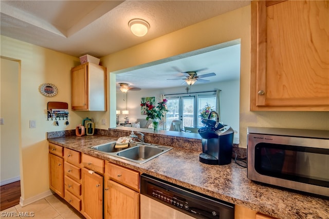 kitchen featuring light tile flooring, ceiling fan, appliances with stainless steel finishes, and sink