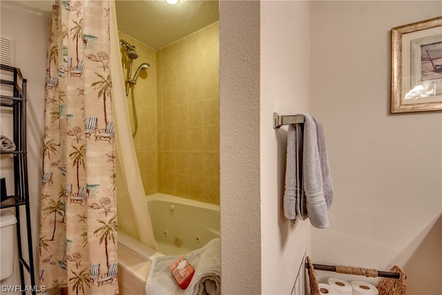 bathroom featuring a textured ceiling and shower / tub combo with curtain