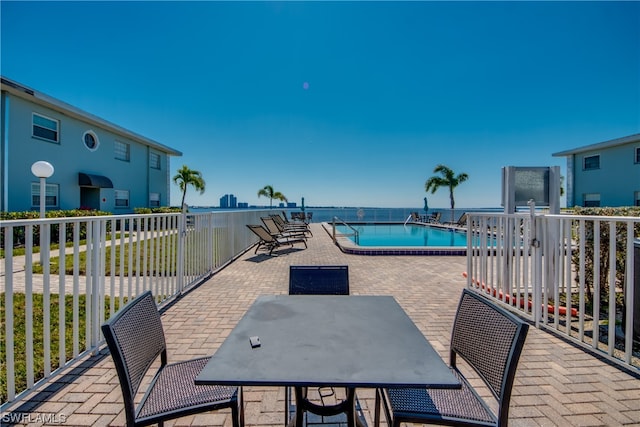 exterior space featuring a patio and a water view