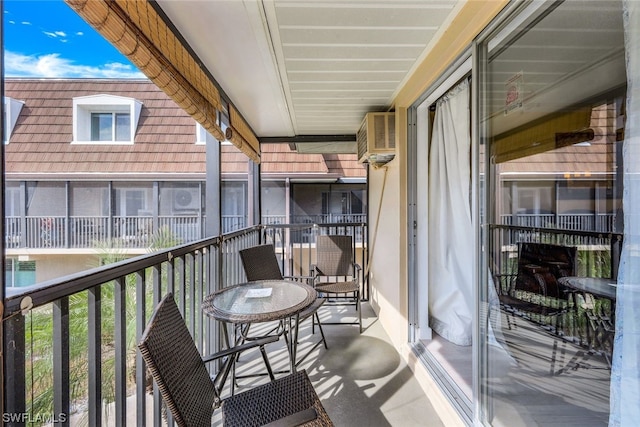 balcony featuring a wall unit AC