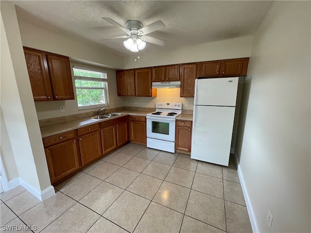 kitchen with white appliances, light tile patterned floors, a textured ceiling, ceiling fan, and sink