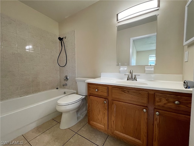 full bathroom featuring vanity, tile patterned flooring, tiled shower / bath combo, and toilet