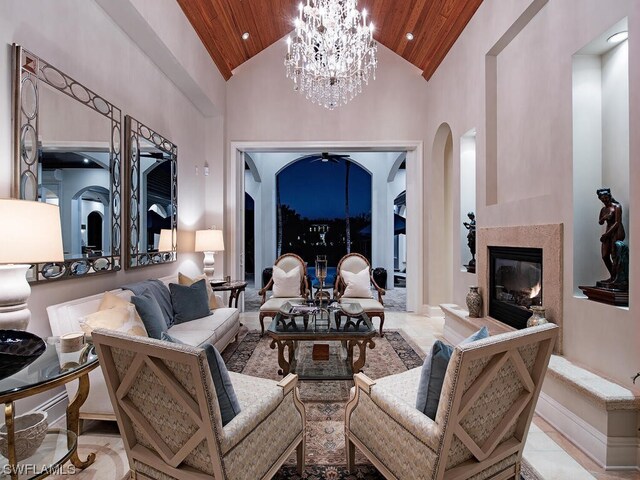 tiled living room with a notable chandelier, high vaulted ceiling, and wooden ceiling