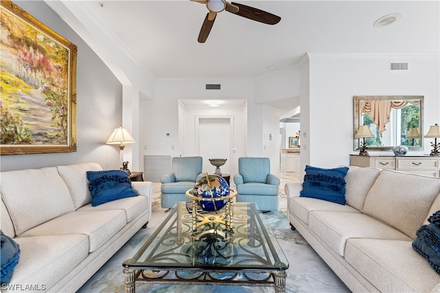 living room with crown molding and ceiling fan