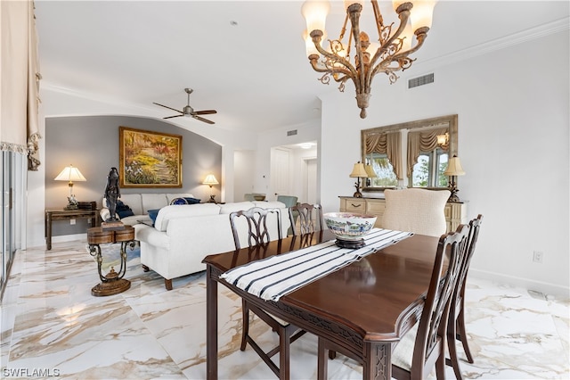 dining room featuring ceiling fan with notable chandelier and vaulted ceiling