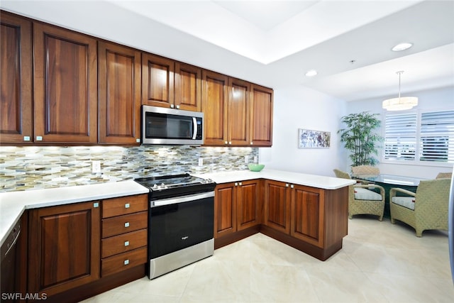 kitchen featuring light tile floors, hanging light fixtures, backsplash, and stainless steel appliances